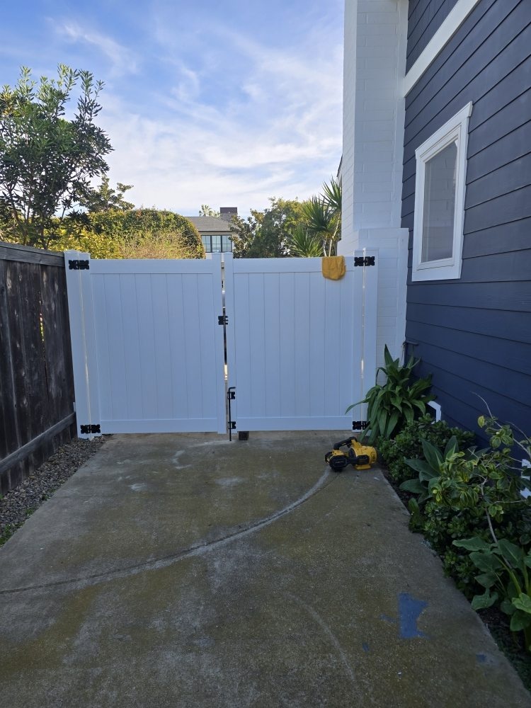 White vinyl privacy double gate project by Islas Fencing