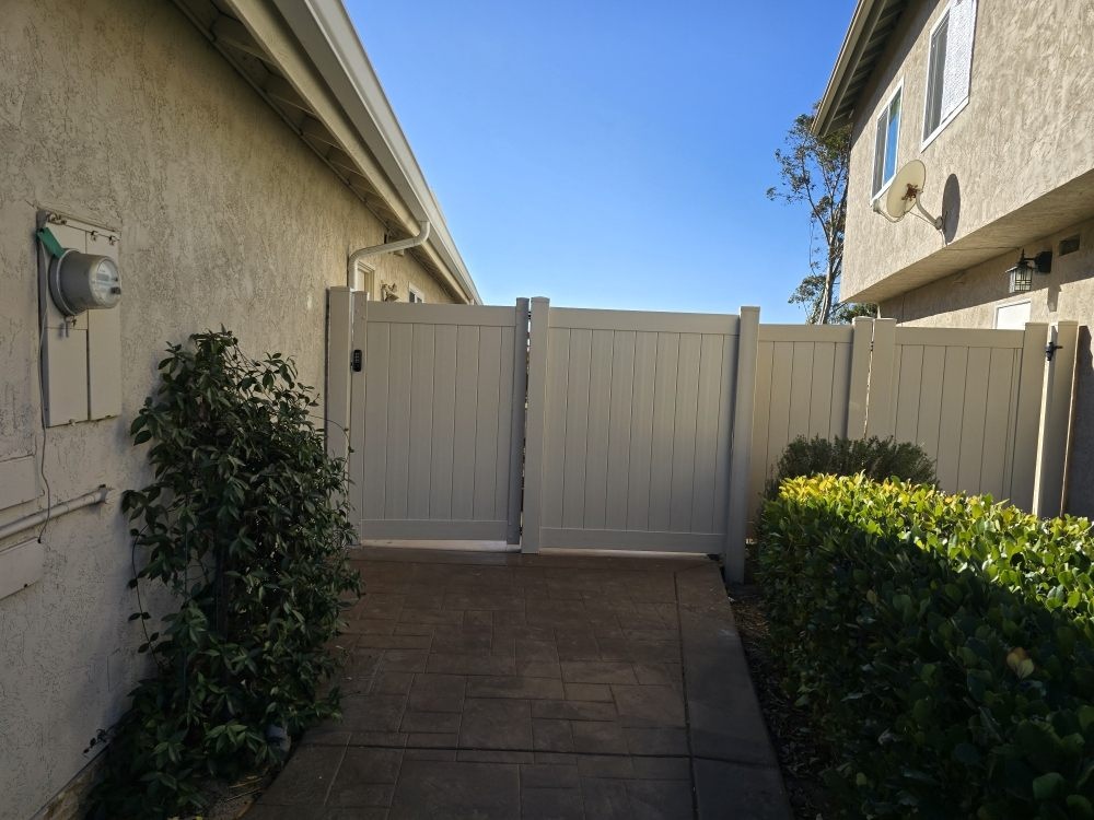 Vinyl privacy double gate fence project by Islas Fencing