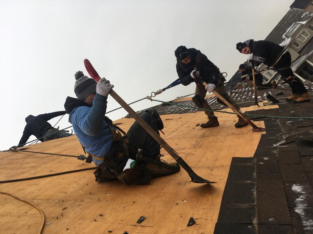 Emergency roof tarping on a home in Scarborough, Ontario