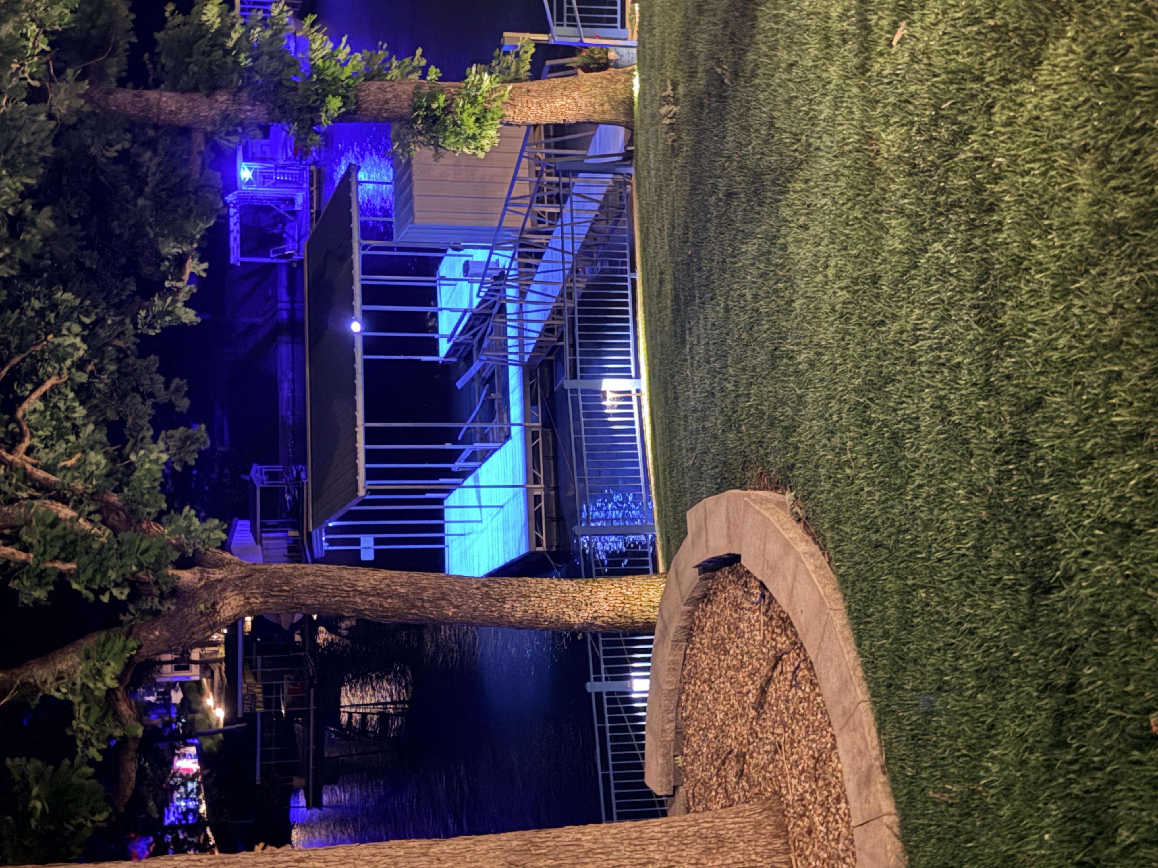 Luminex clear dock coating glowing bright cyan blue on a Lake of the Ozarks dock after nightfall