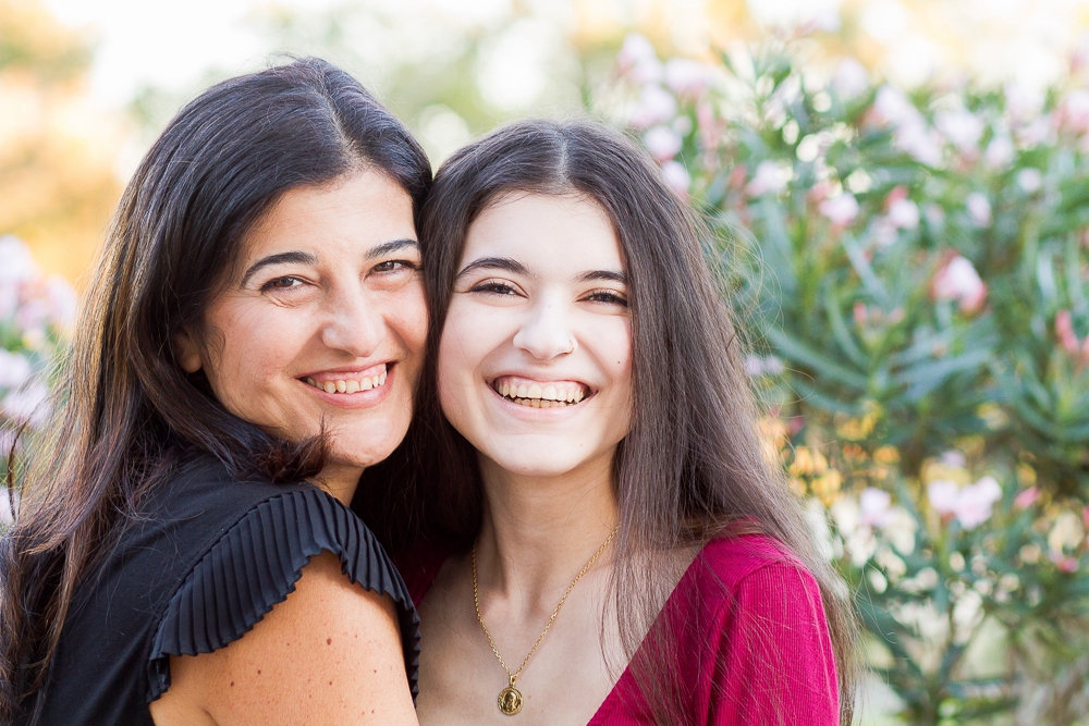 Senior and her mom sharing a close hug
