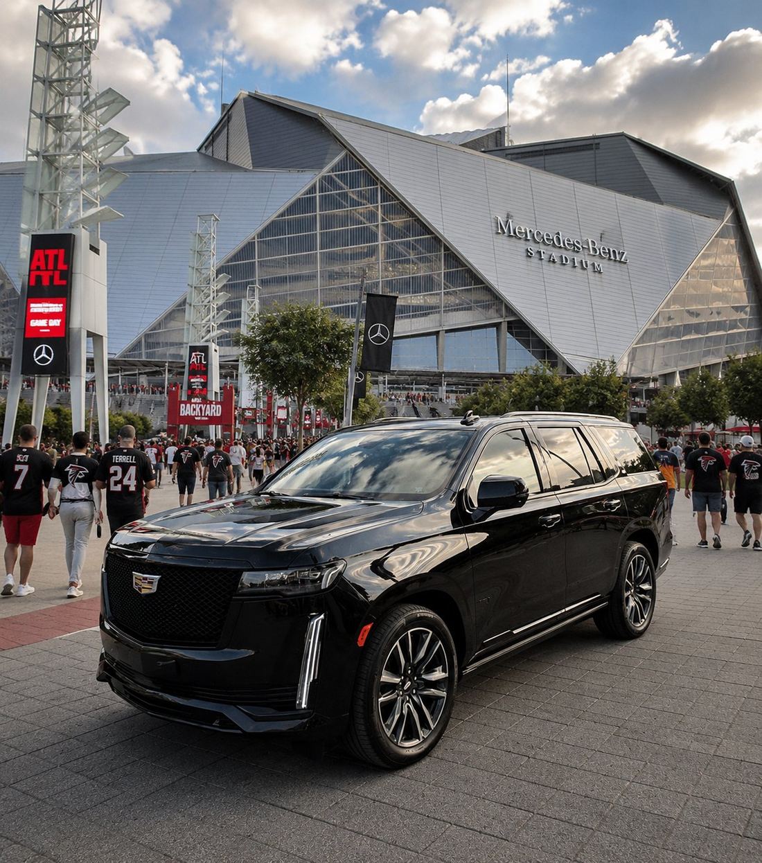 Black Cadillac Escalade SUV in front of Mercedes-Benz Stadium on Atlanta Falcons game day — Opulent Transport luxury chauffeur service for Atlanta events, concerts, and sporting events