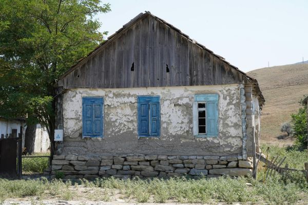 Rustic Old House with Blue Shutters