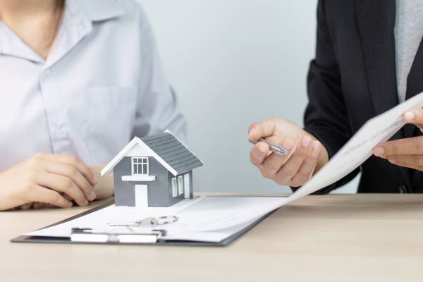 Real Estate Broker Explaining the Contract 