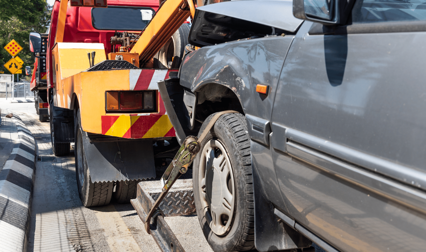 Damaged car being towed
