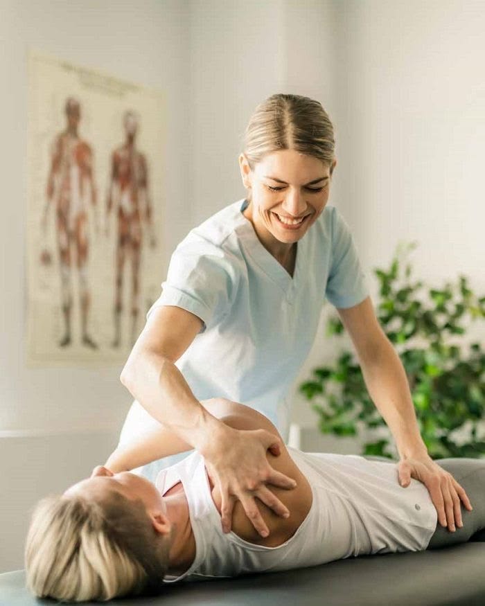 Therapist treating a client at The Body Temple Spa