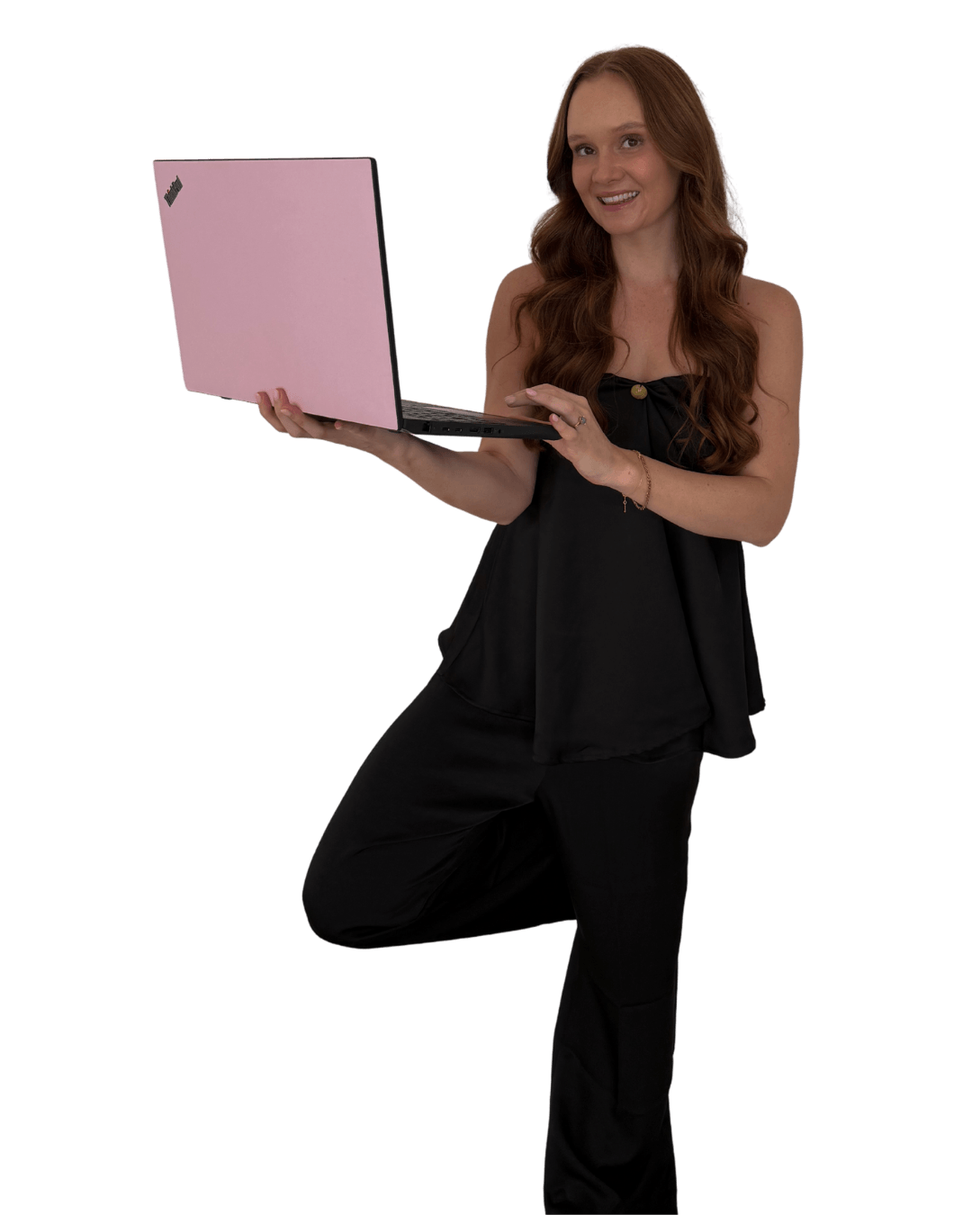 Mikaela, co-founder of Health Coach Growth Hub, working on her laptop
