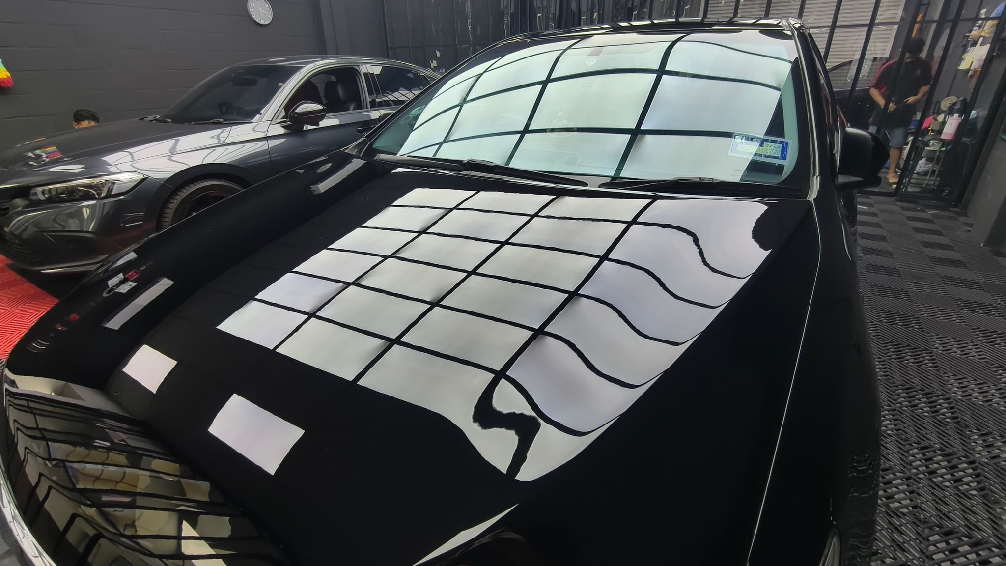 Deep gloss finish on ceramic-coated black car