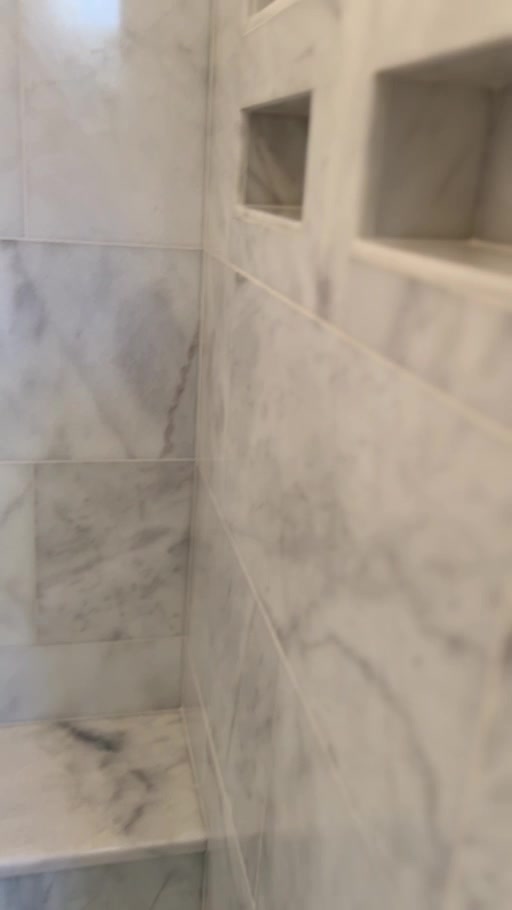 Alpine project: light veined shower tile with recessed niches