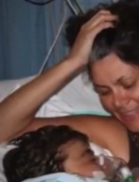 Vivian embracing Sophia at her hospital bedside