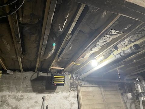 Thermostatically controlled unit heater in an unfinished Scranton, PA rental basement, used to keep pipes from freezing