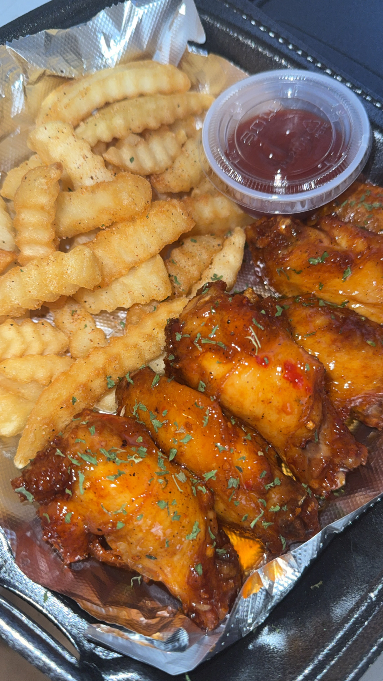 Greedy Gang Wednesday meal with wings and fries