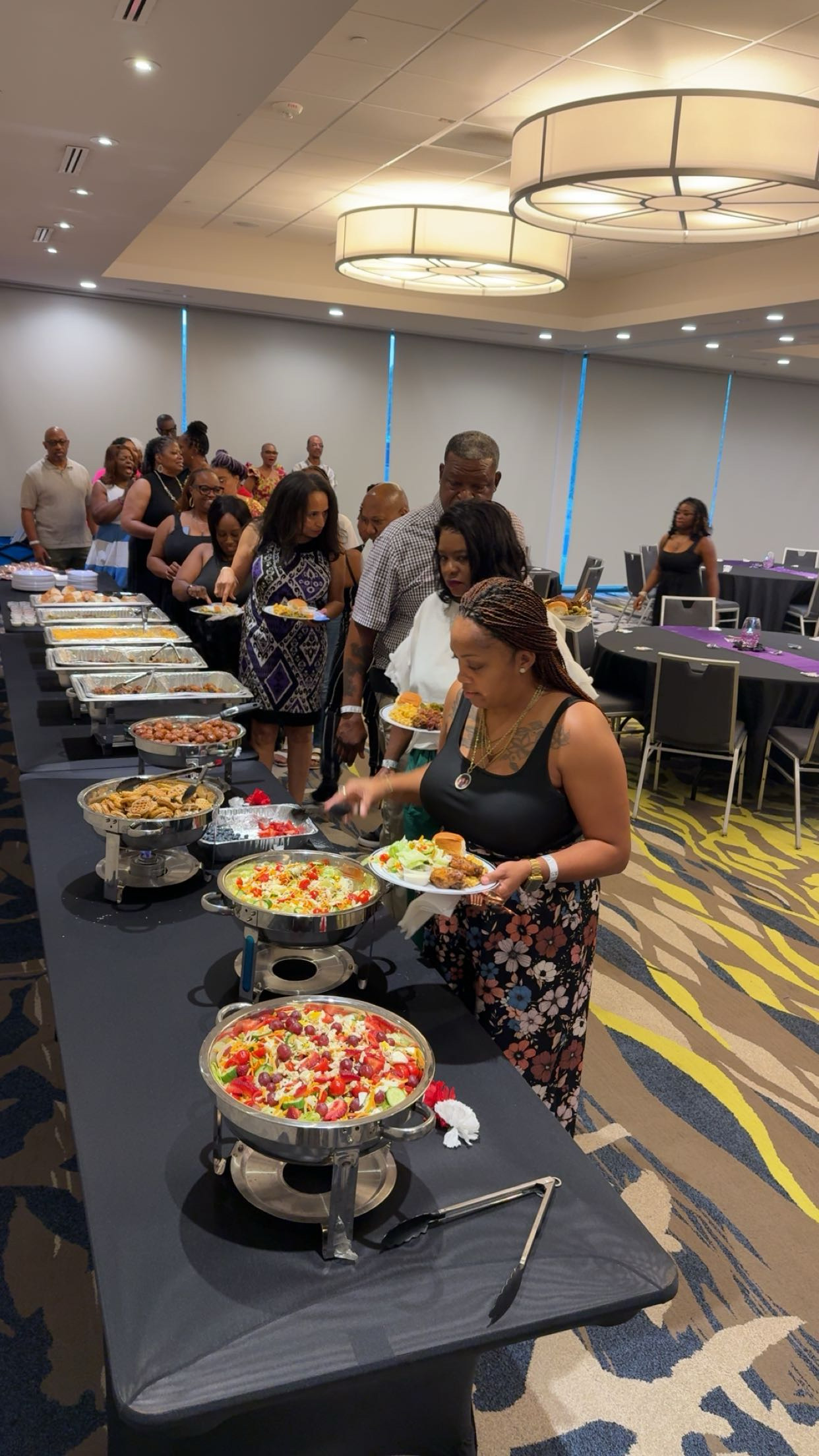 Greedy Gang buffet line with guests serving food