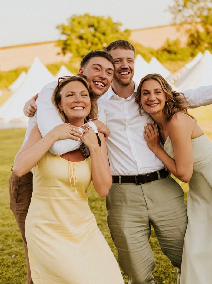 Friends celebrating together at an outdoor wedding