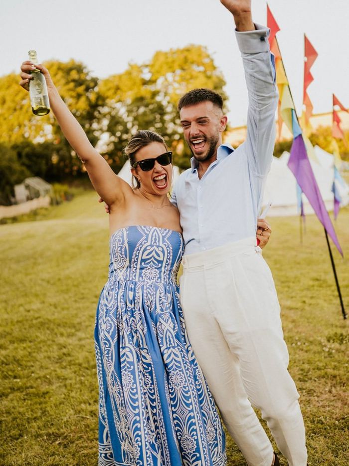 A couple celebrating outdoors at their wedding