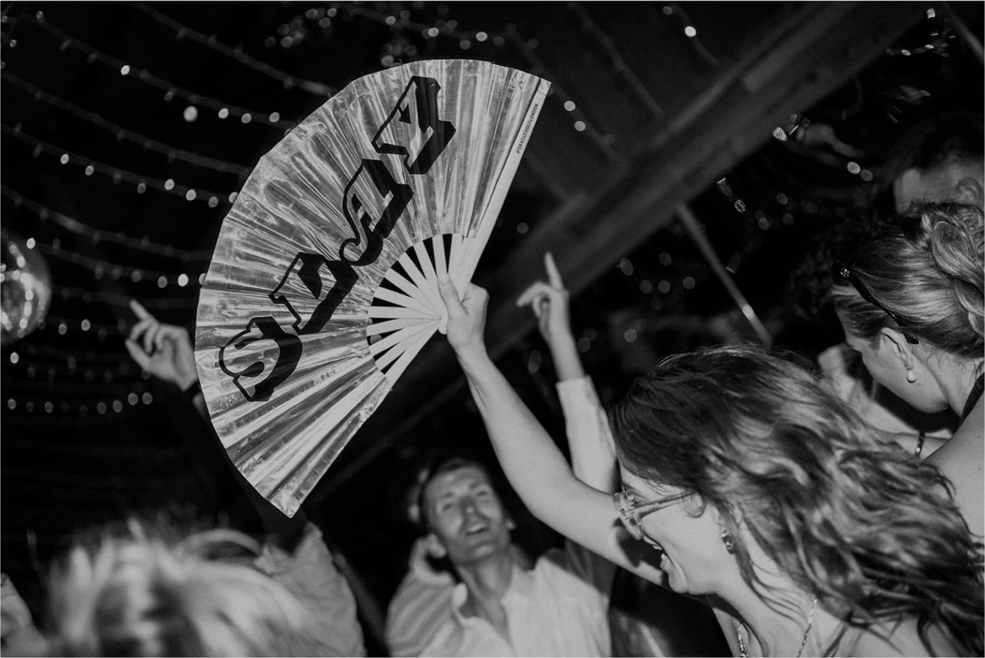 Guests celebrating and dancing at a wedding