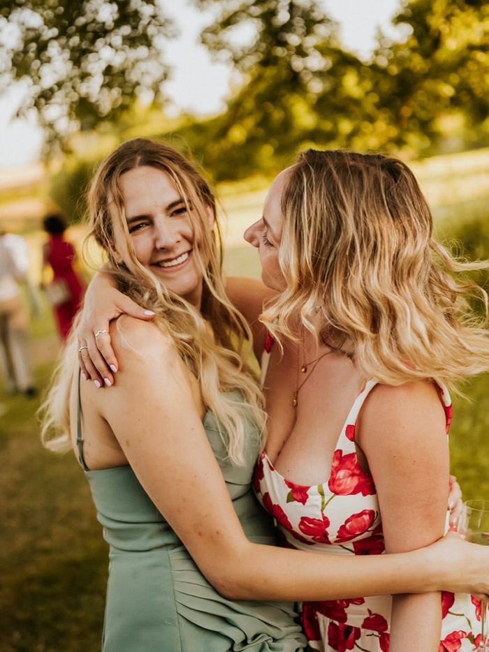 Friends celebrating at an outdoor wedding