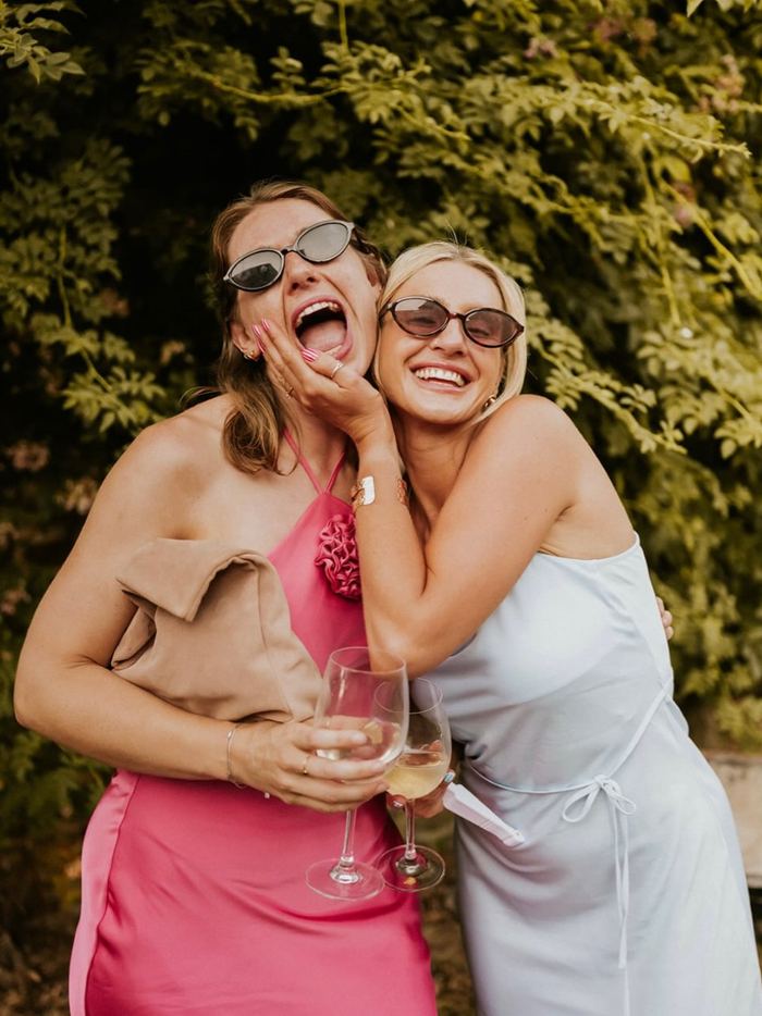 Friends laughing together at a celebration