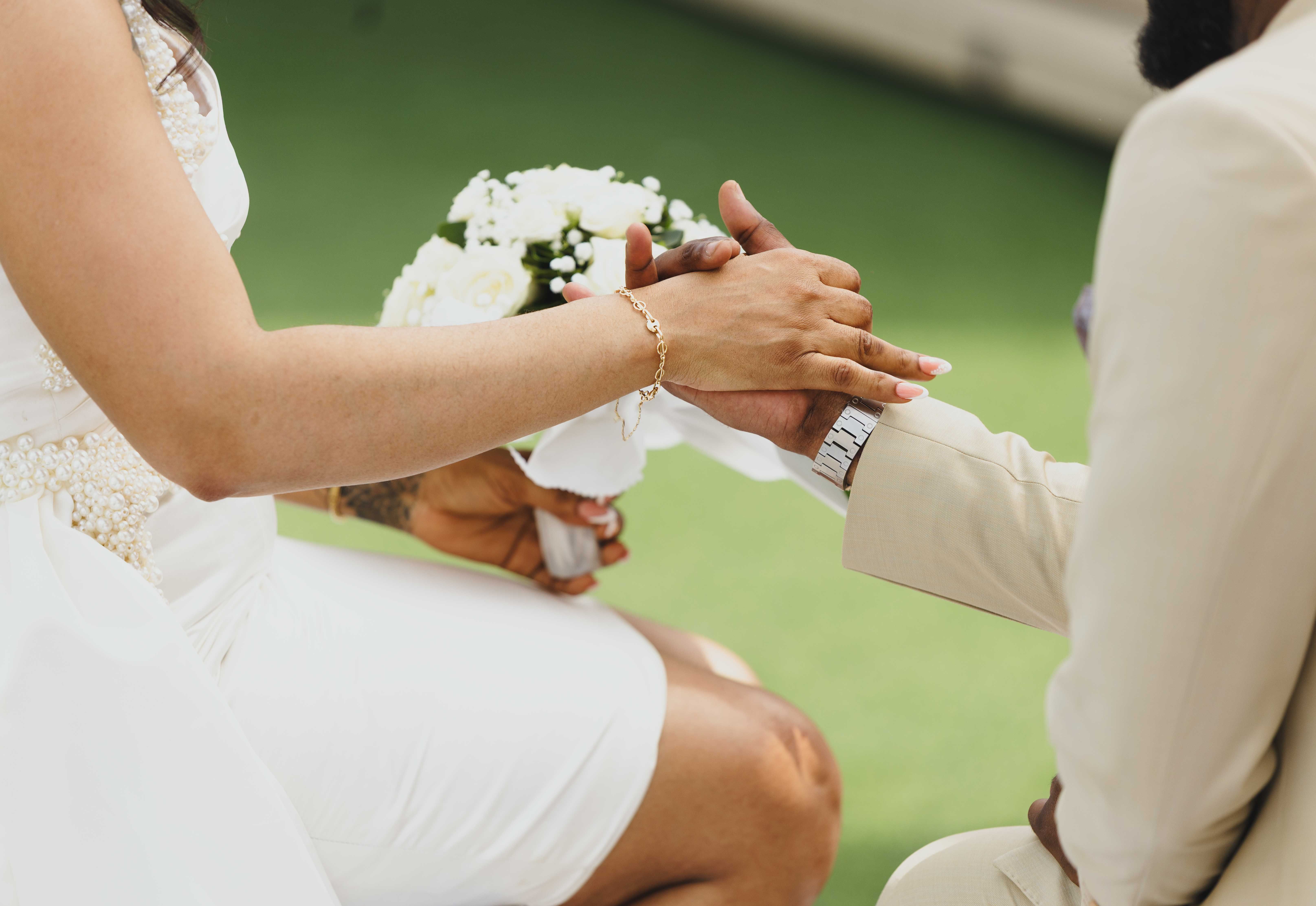 A couple sharing a joyful moment on their wedding day