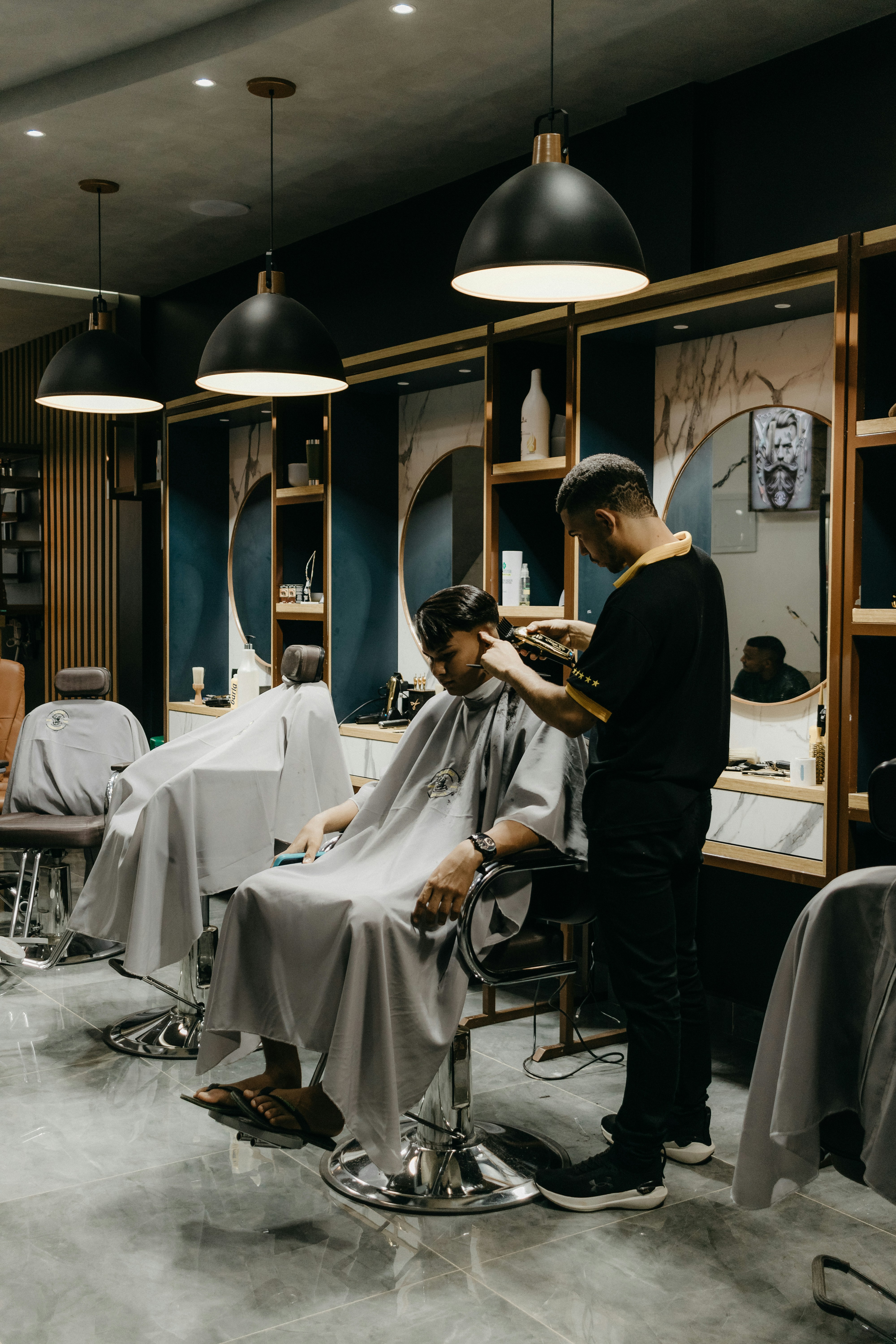 Barber cutting a customer's hair in a barbershop