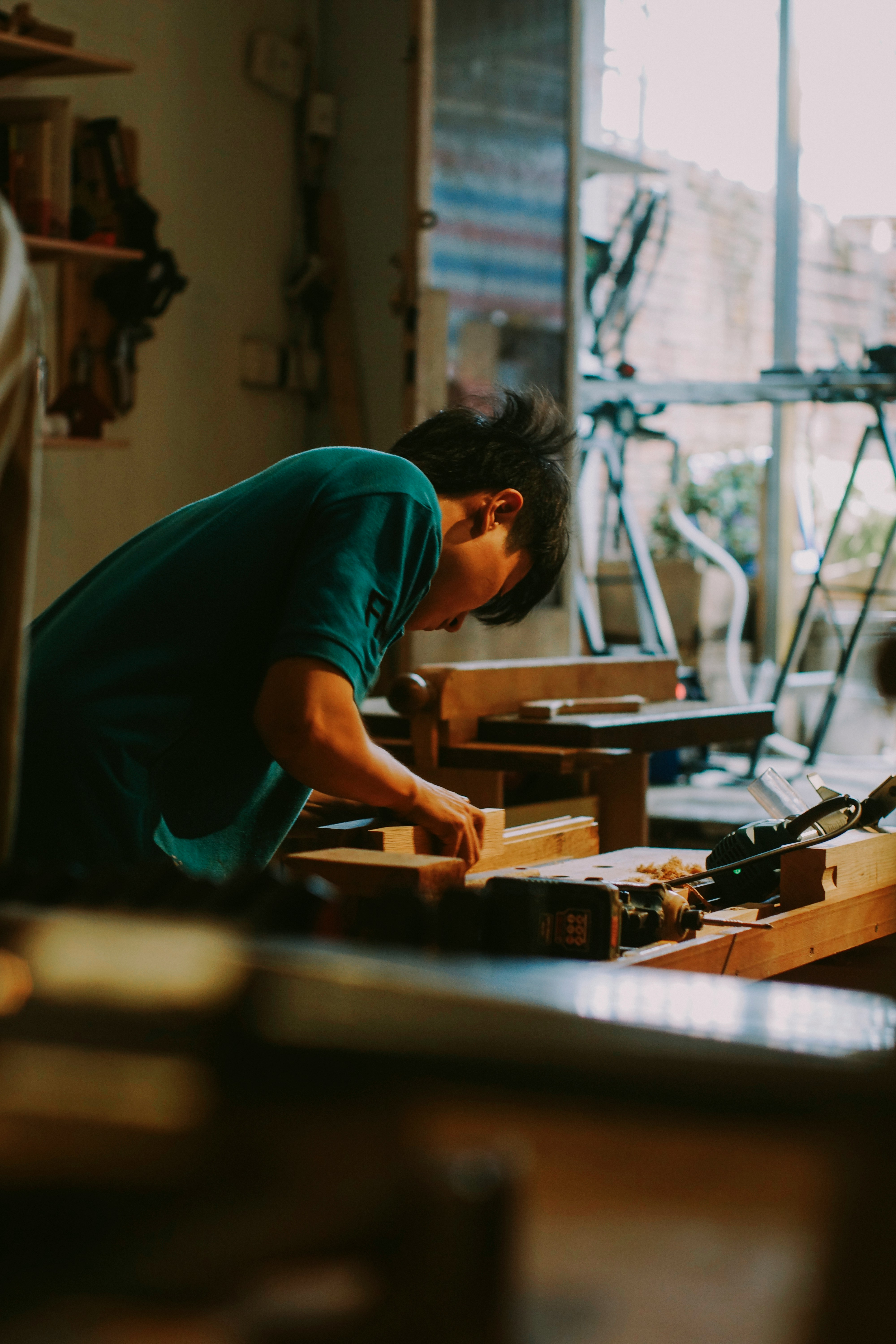 Carpenter working with wood in a workshop