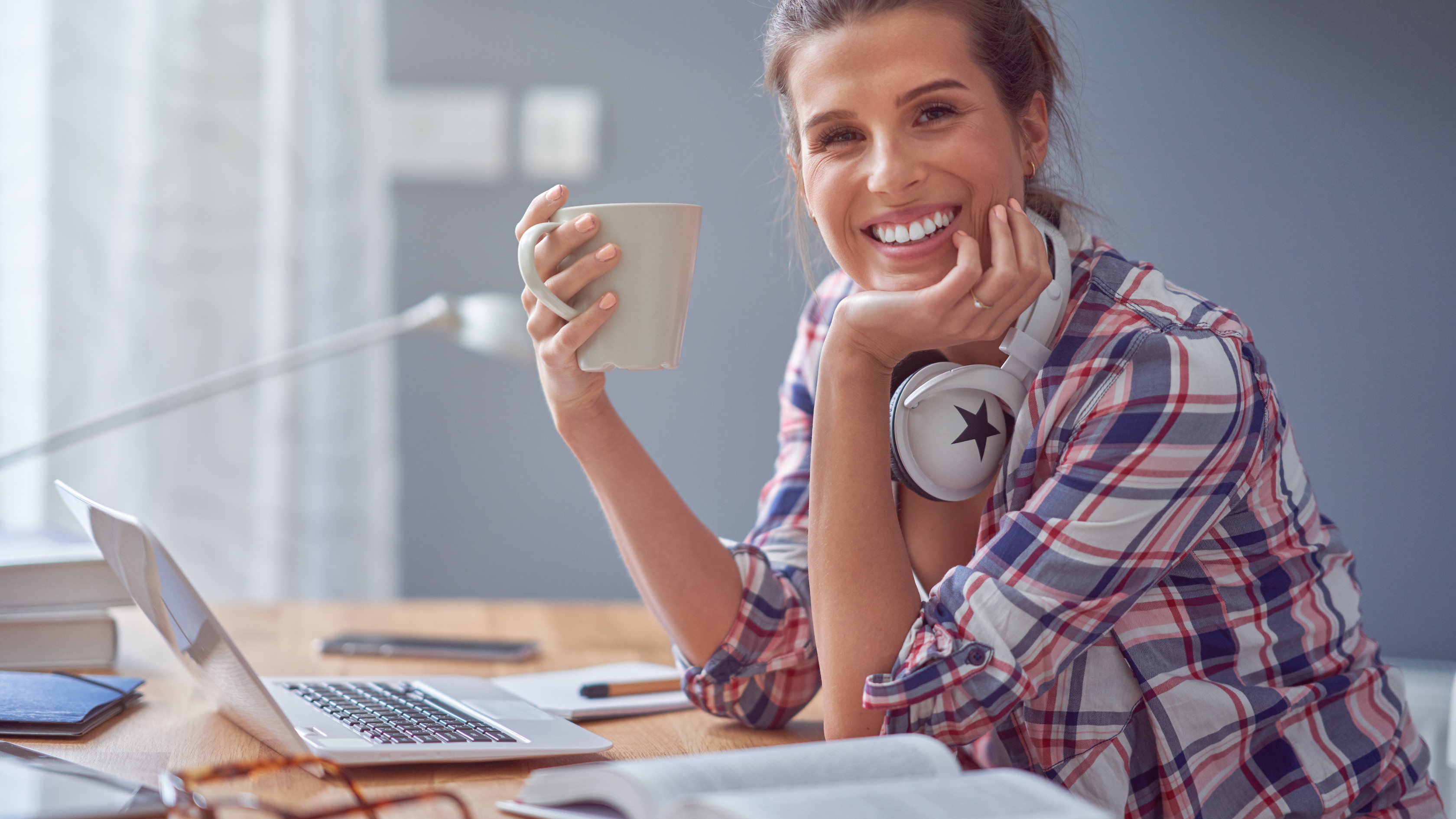 Professional woman enjoying fresh air while multitasking with her smartphone and digital tablet