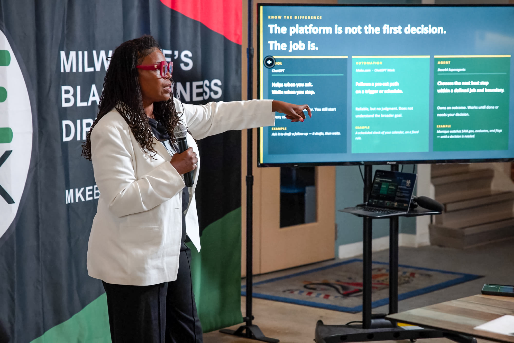 Natasha Broxton speaking to an audience at a professional business event
