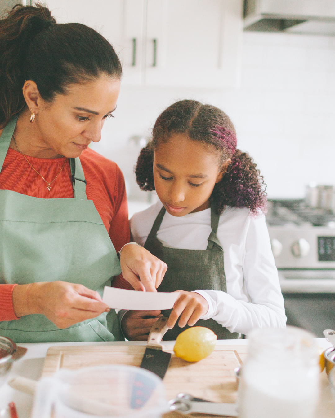 Mum and daughter reading recipe
