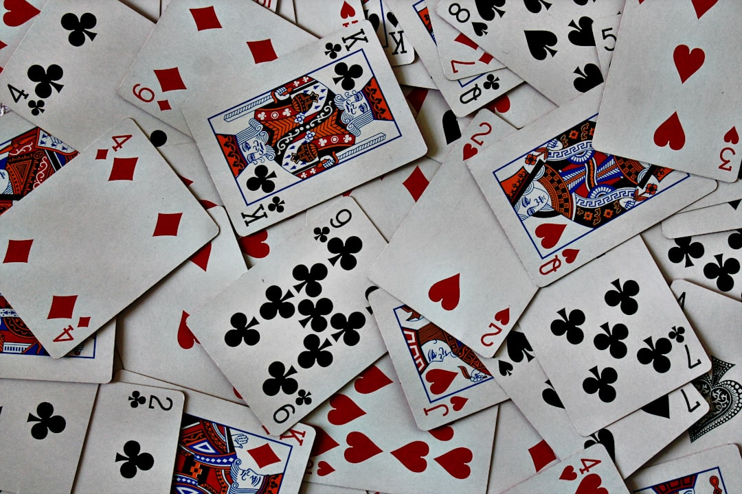 Playing cards spread over the table.