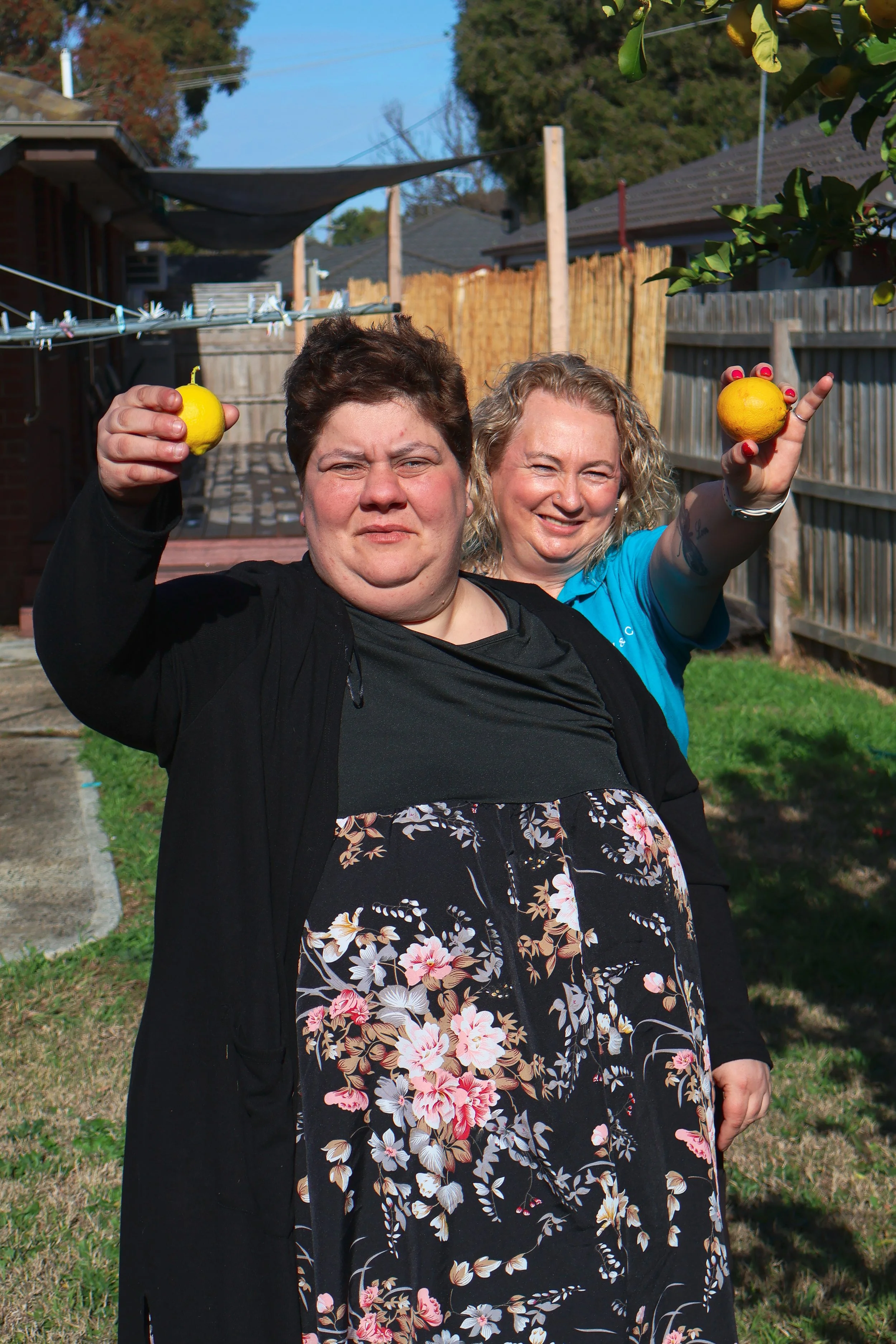 Karen and a participant in the backyard at our Cranbourne home