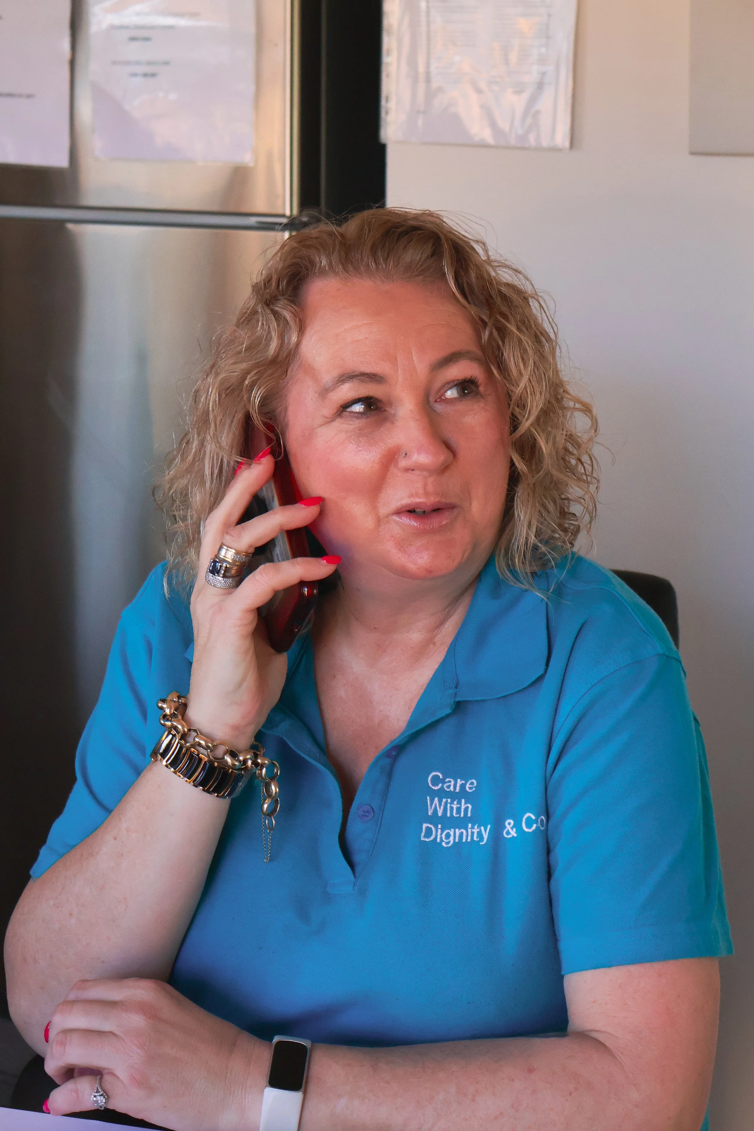 Karen taking a call at Care With Dignity