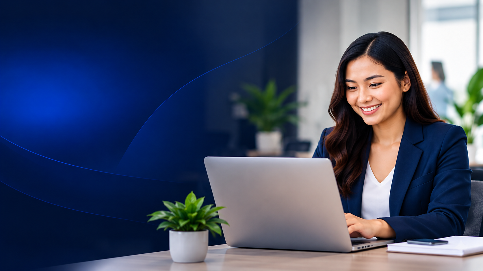 StaffWiz recruiter wearing a headset, working on a laptop