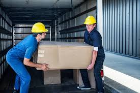 Two men lifting a box Two men lifting a box