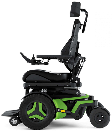 Custom power wheelchair with green trim built by DMR Corp