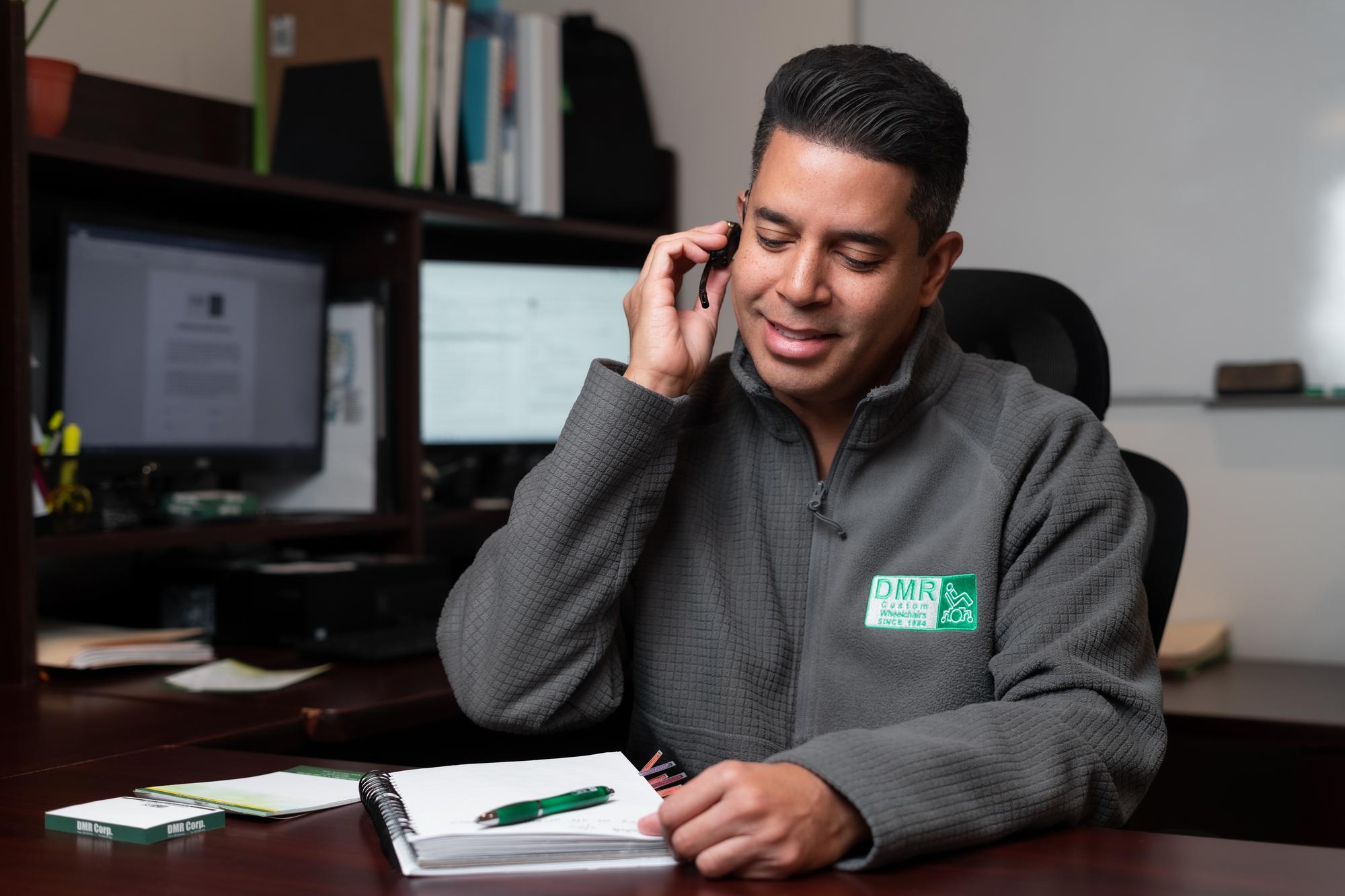 DMR Corp staff assisting a patient by phone