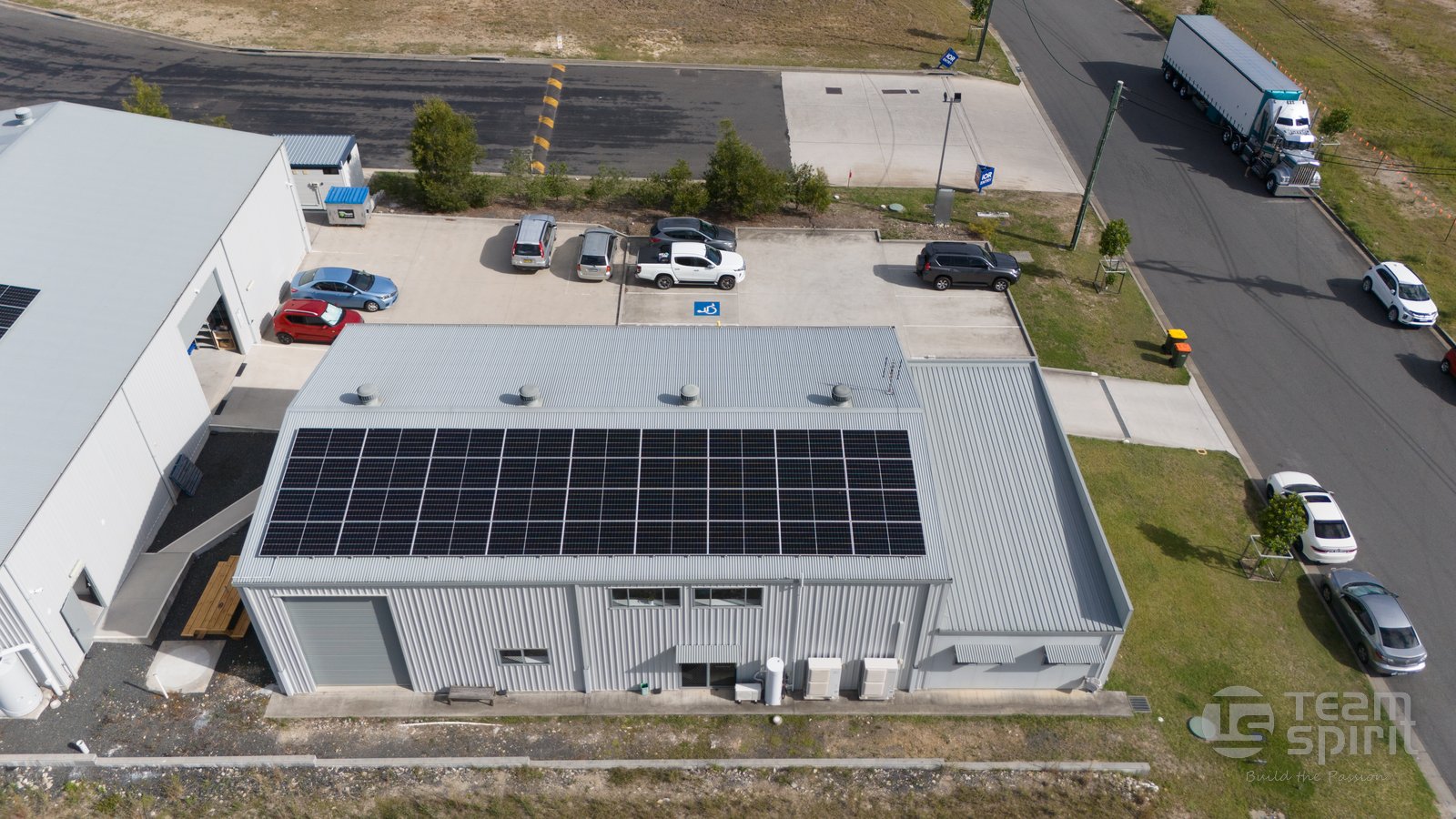 Aerial view of rooftop solar installed by South Kempsey Solar on the Team Spirit Sports building in South Kempsey