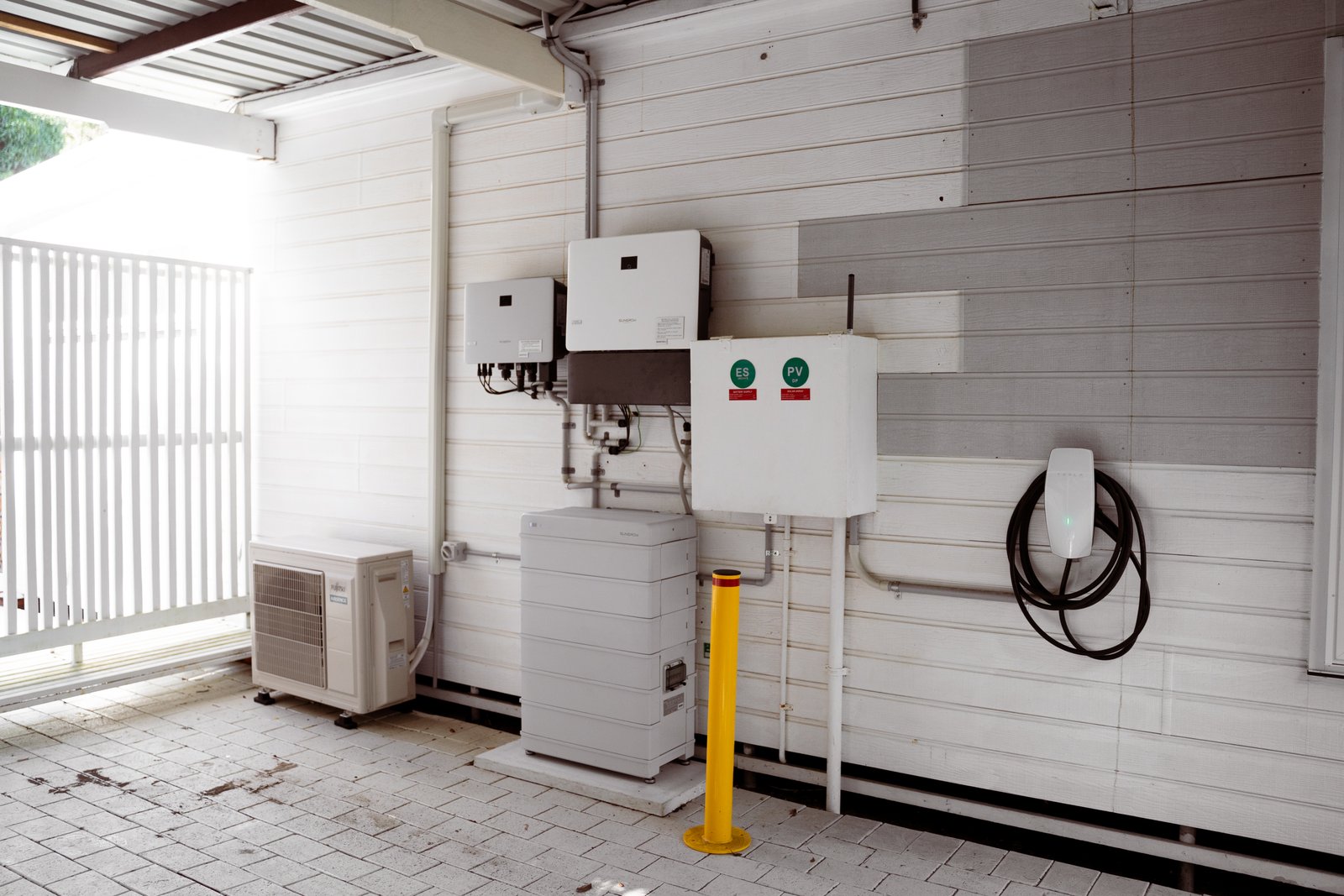 Home battery and inverters installed on a wall