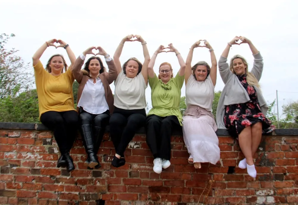 Women sharing a joyful retreat moment