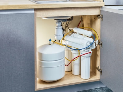 Reverse osmosis water filtration system installed under a kitchen sink, ensuring clean and safe drinking water