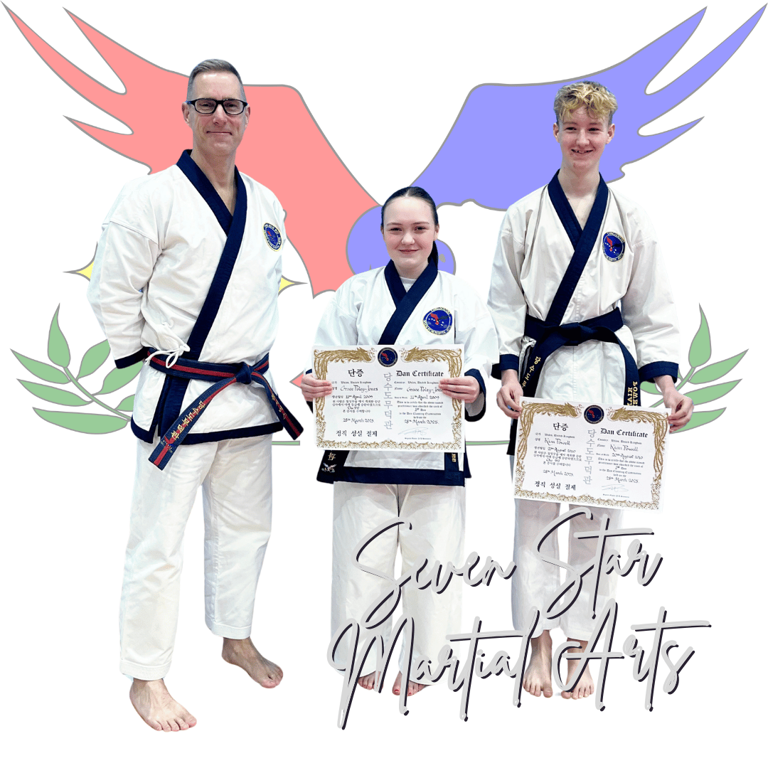 2 students being presented with their black belts my master summers the instructor