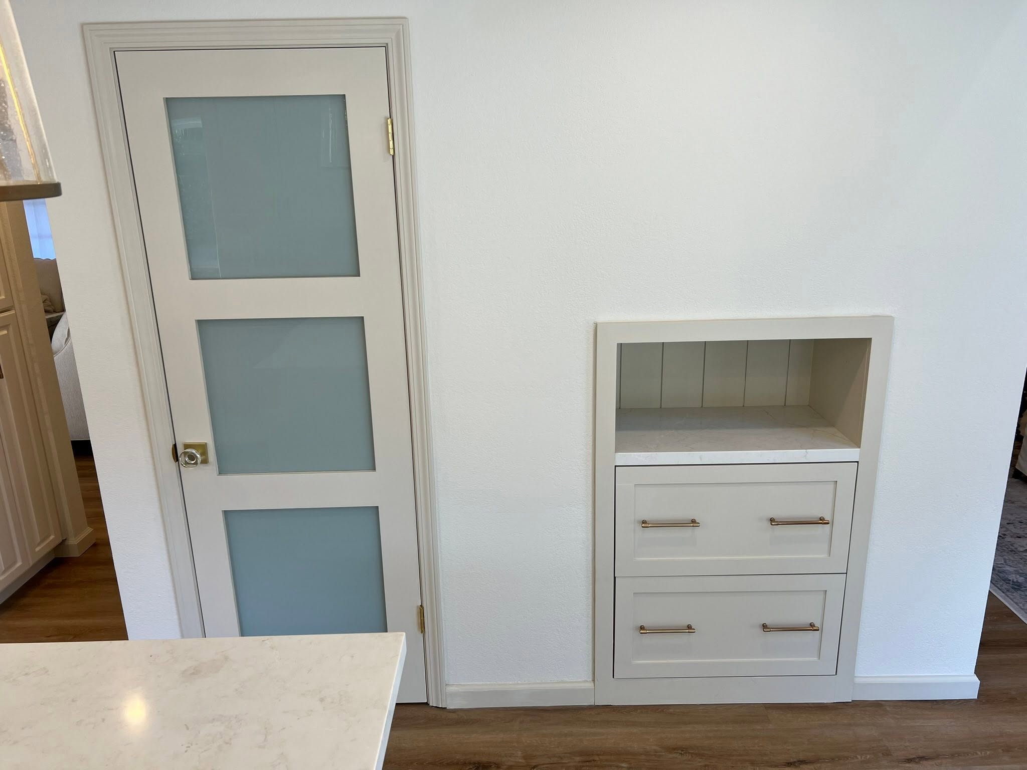 Frosted glass doors and built-in cabinet — Niche Construction