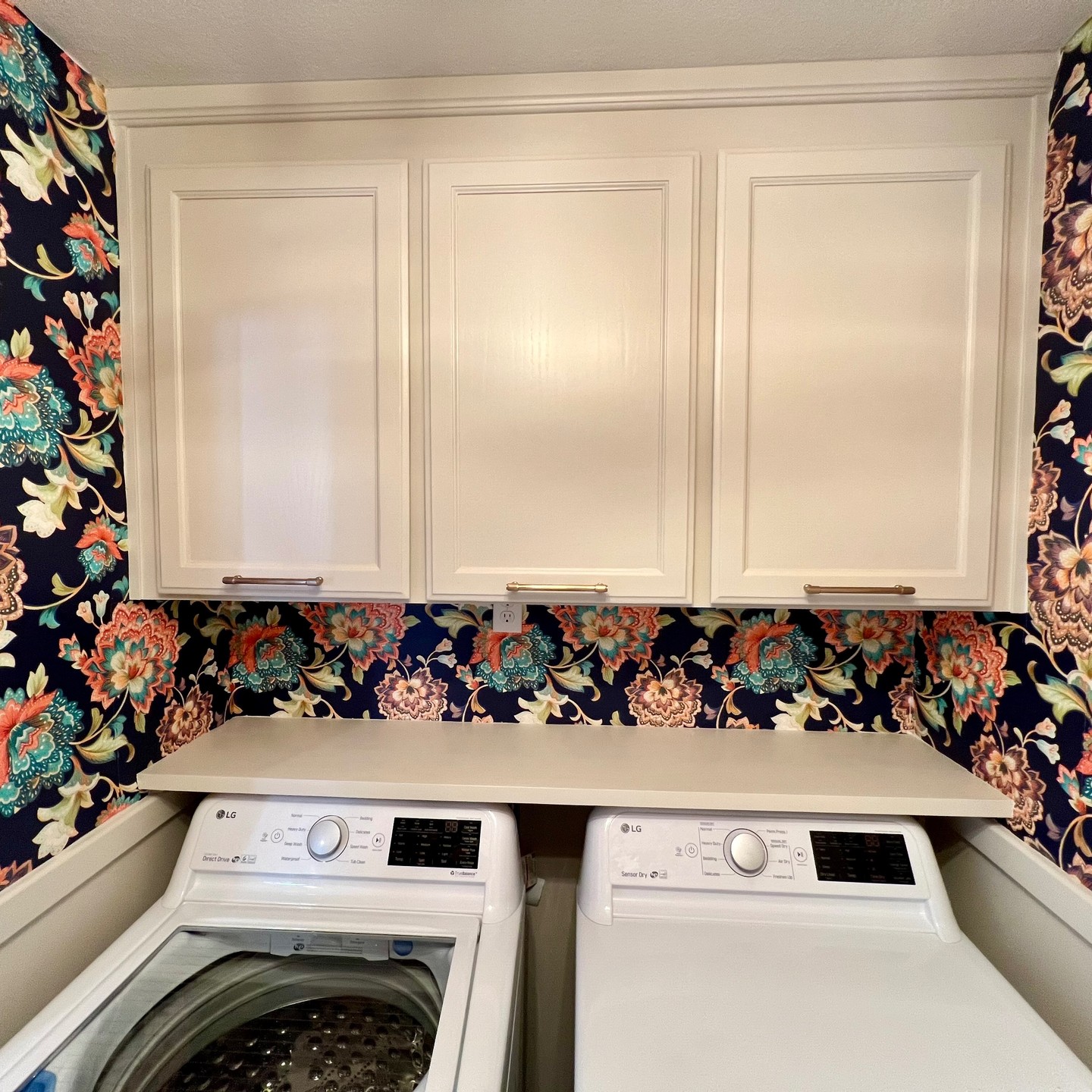 Laundry room with custom cabinets — Niche Construction