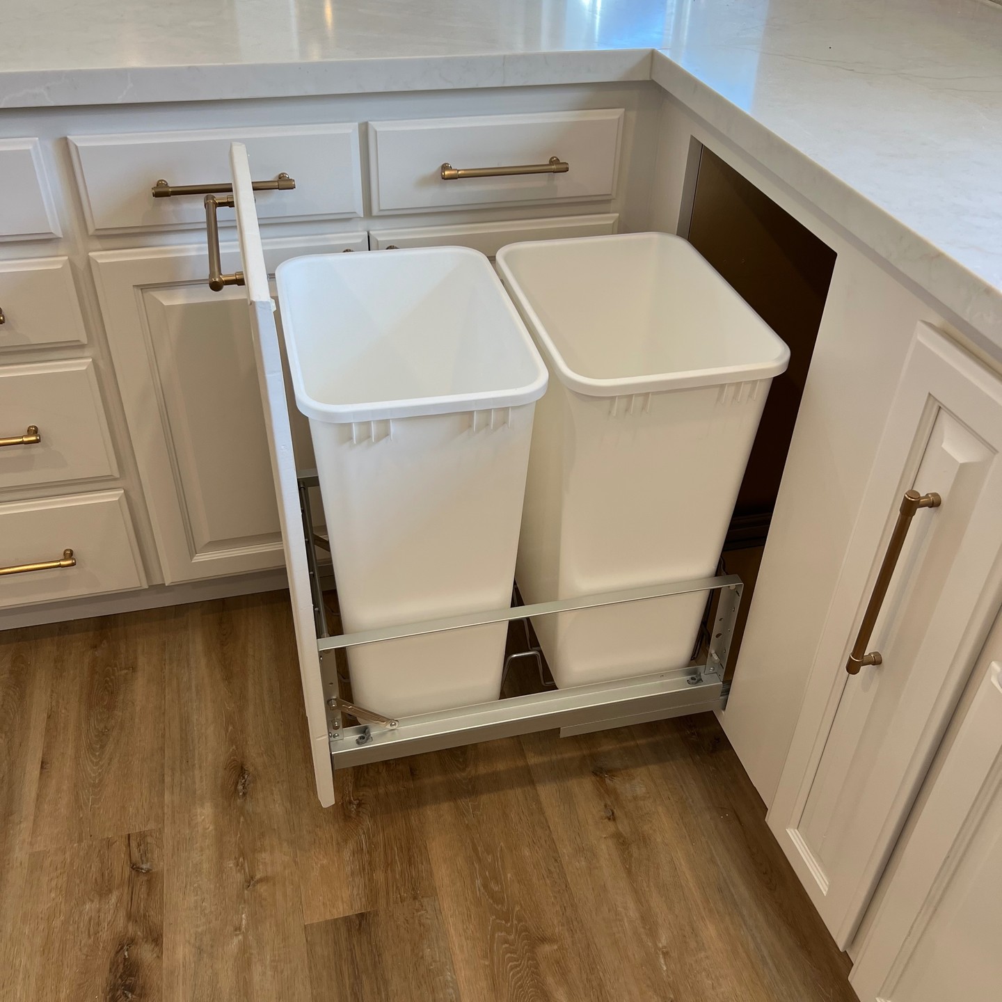 Custom pull-out trash cabinet — Niche Construction