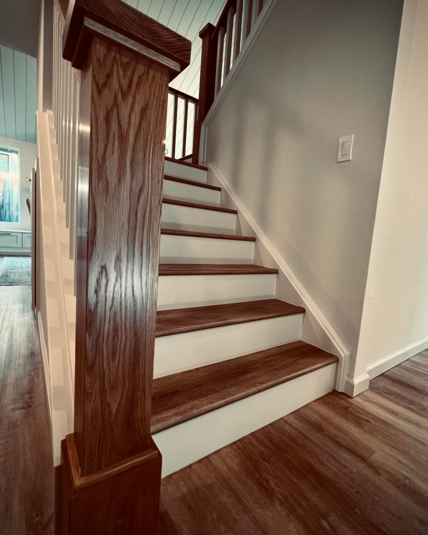 Custom wood newel post and stair treads — Niche Construction