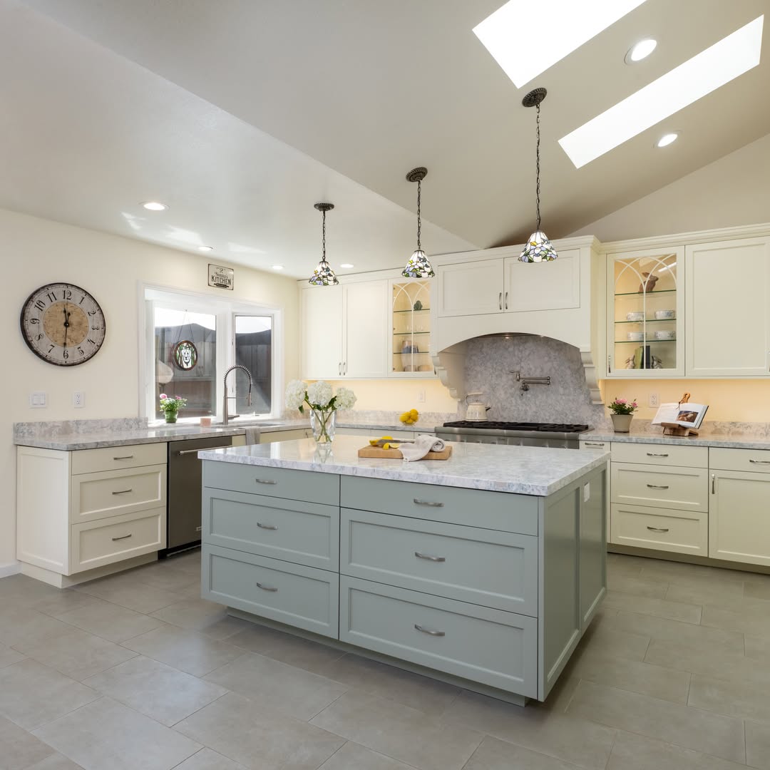 Bright custom kitchen renovation with island by Niche Construction