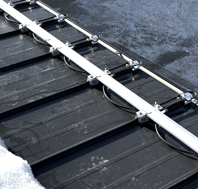 S-5! clamps used to attach heat tape to a metal roof without roof penetrations