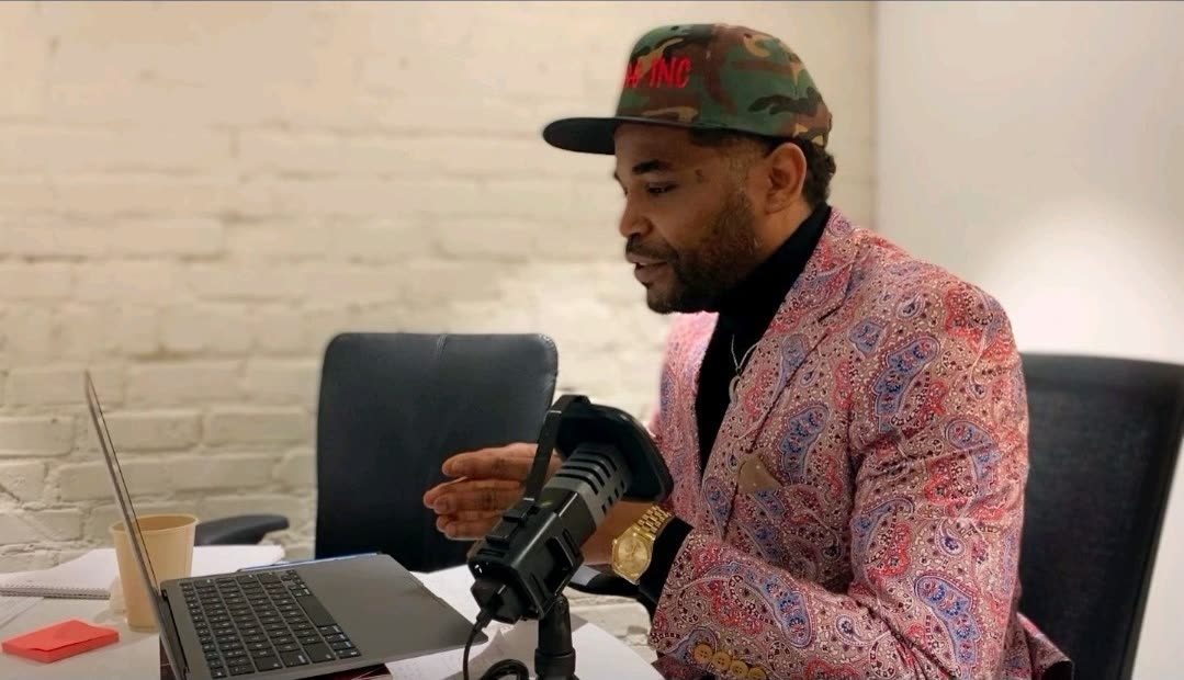 Na'im Al-Amin at a microphone