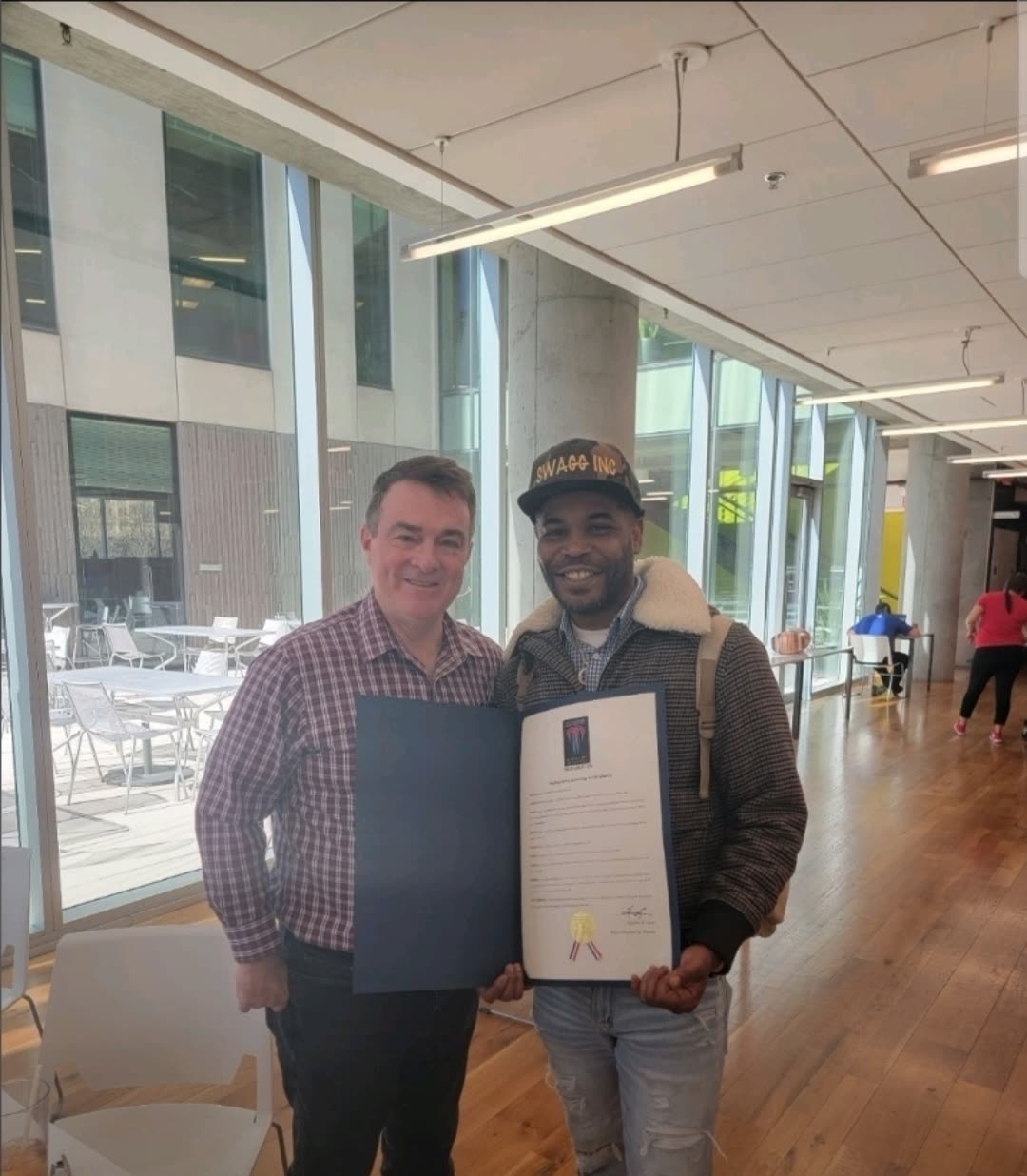 Na'im Al-Amin receiving a proclamation