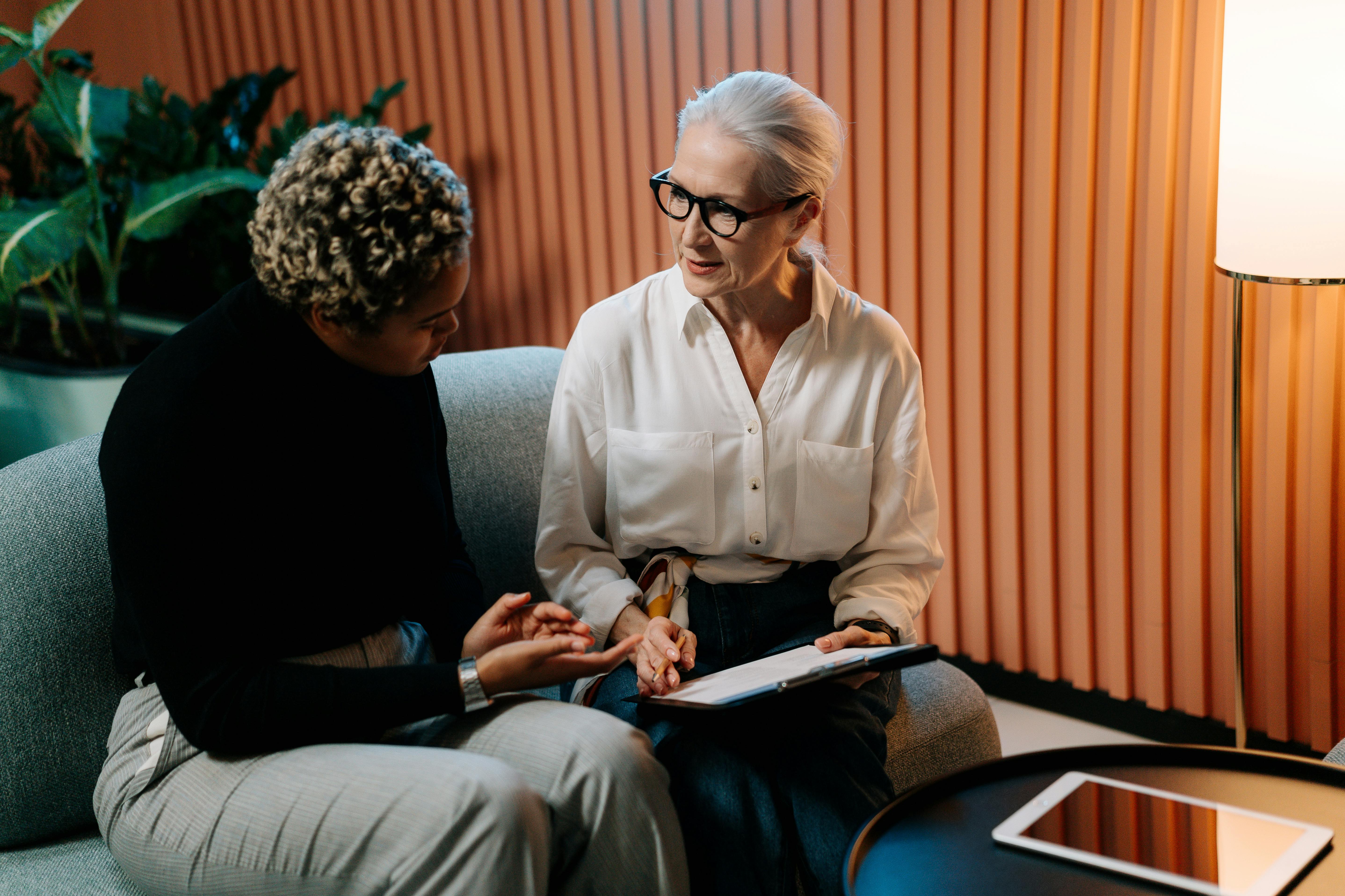 Two Seniors Looking At A Tablet