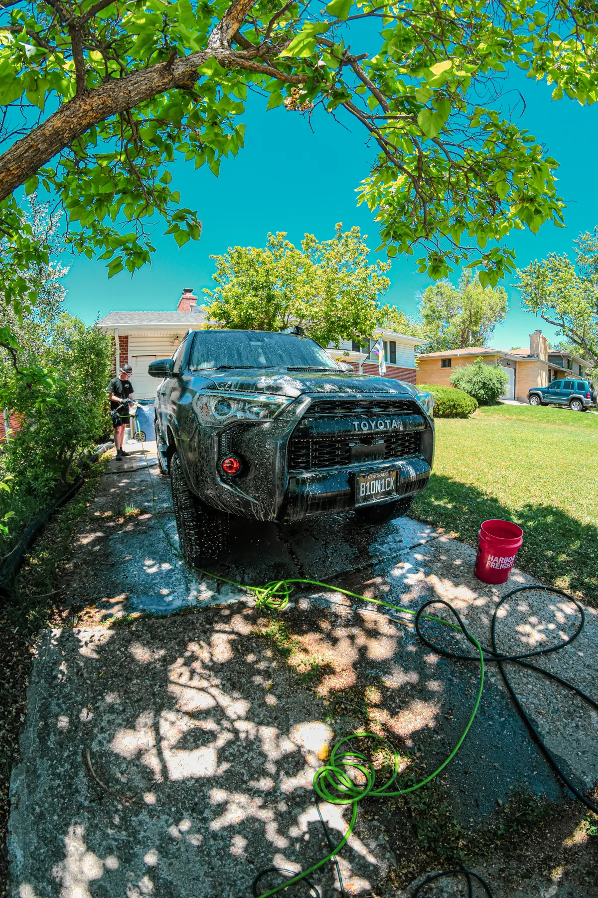 ACS team washing a Toyota 4Runner at a customer’s home